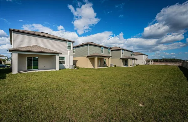 a view of a house with a big yard