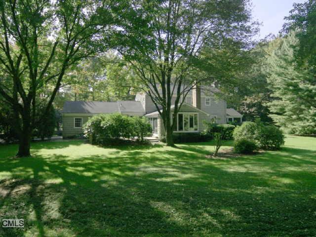 330 Middlesex Road Darien, CT 06820 - Photo 1 of 1 a view of a house with a big yard and large trees