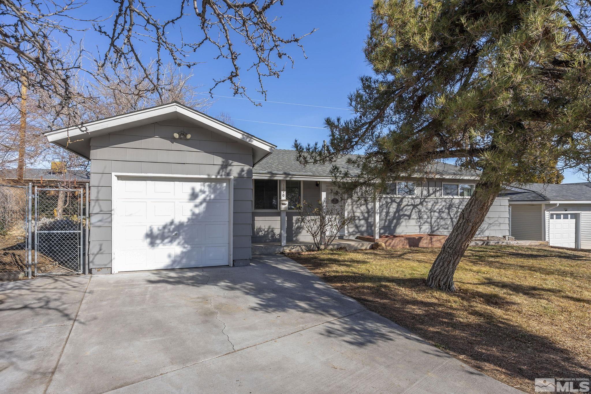 1370 Beldon Way Reno, NV 89503 - Photo 1 of 23 a front view of a house with a yard