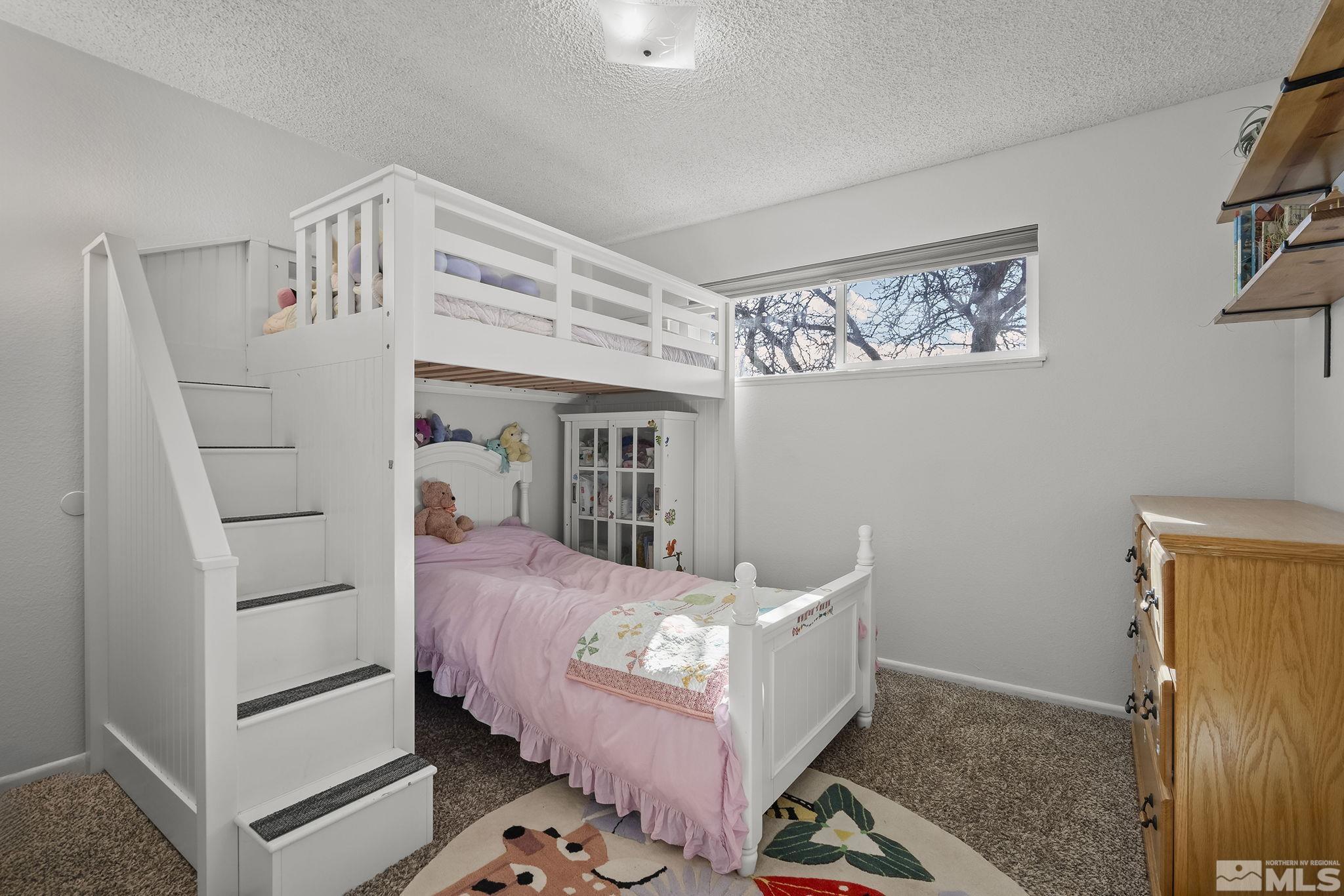 1370 Beldon Way Reno, NV 89503 - Photo 17 of 23 a bed room with a bed and a window