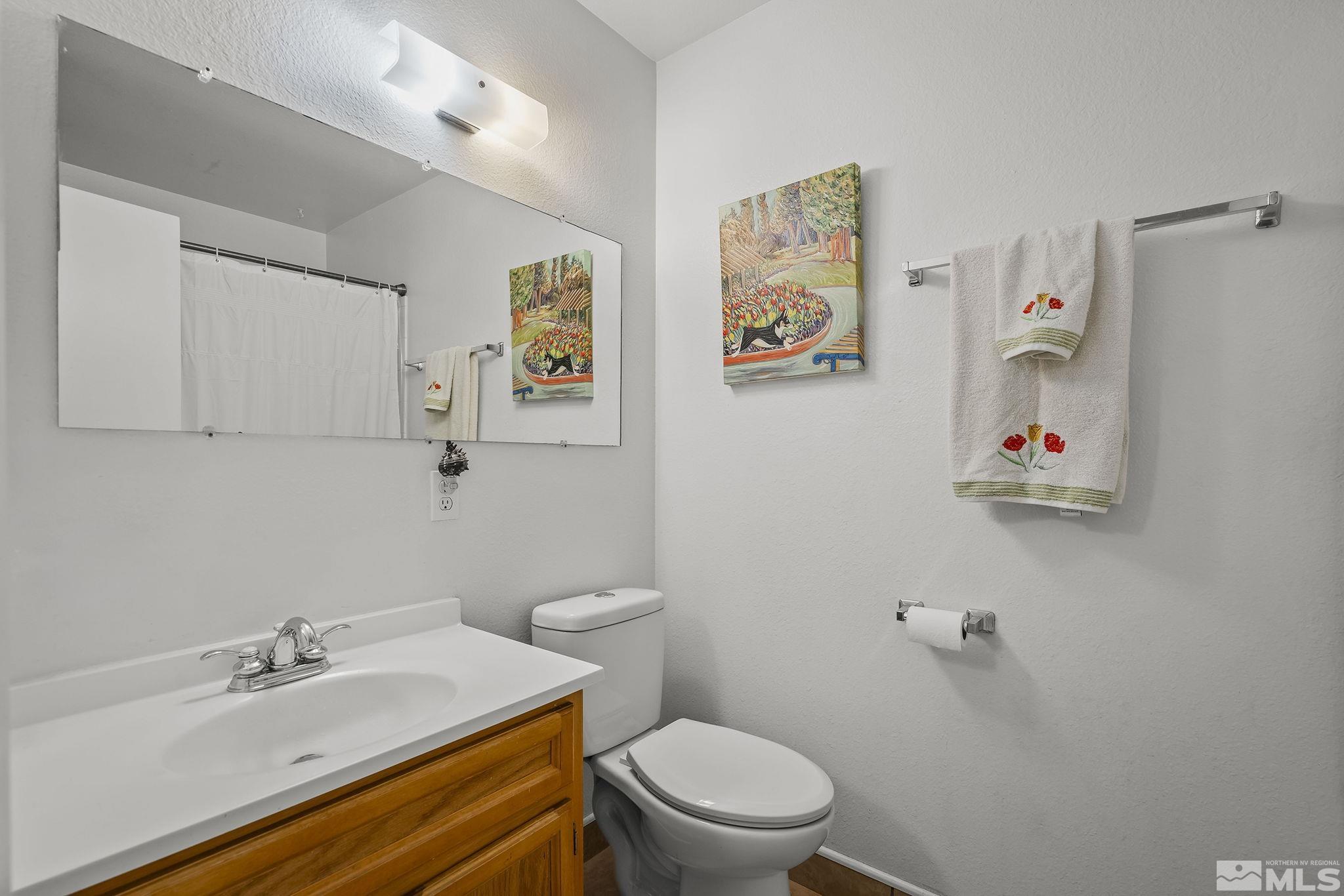 1370 Beldon Way Reno, NV 89503 - Photo 18 of 23 a bathroom with a sink mirror vanity and toilet