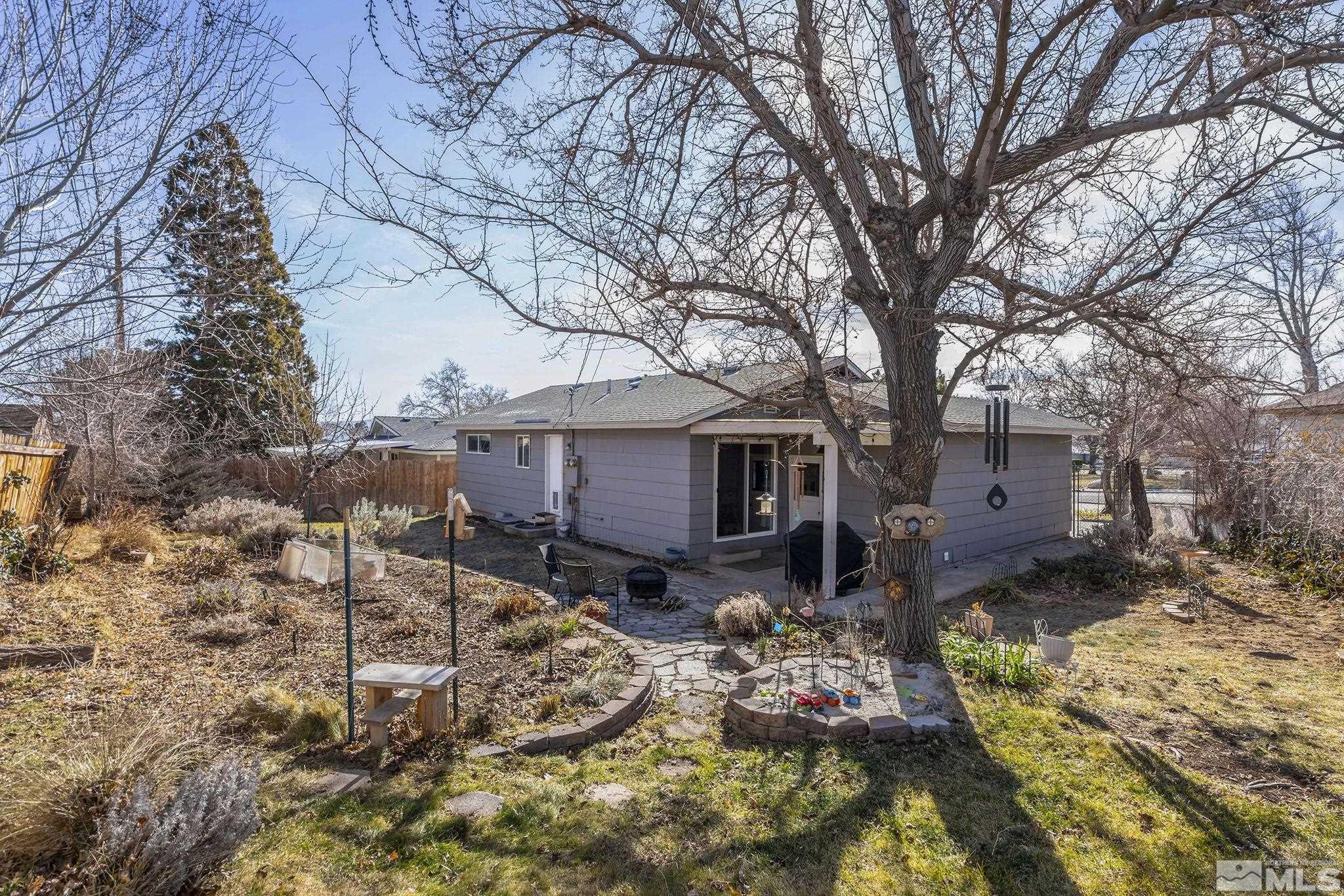 1370 Beldon Way Reno, NV 89503 - Photo 20 of 23 a backyard of a house with barbeque oven and outdoor seating