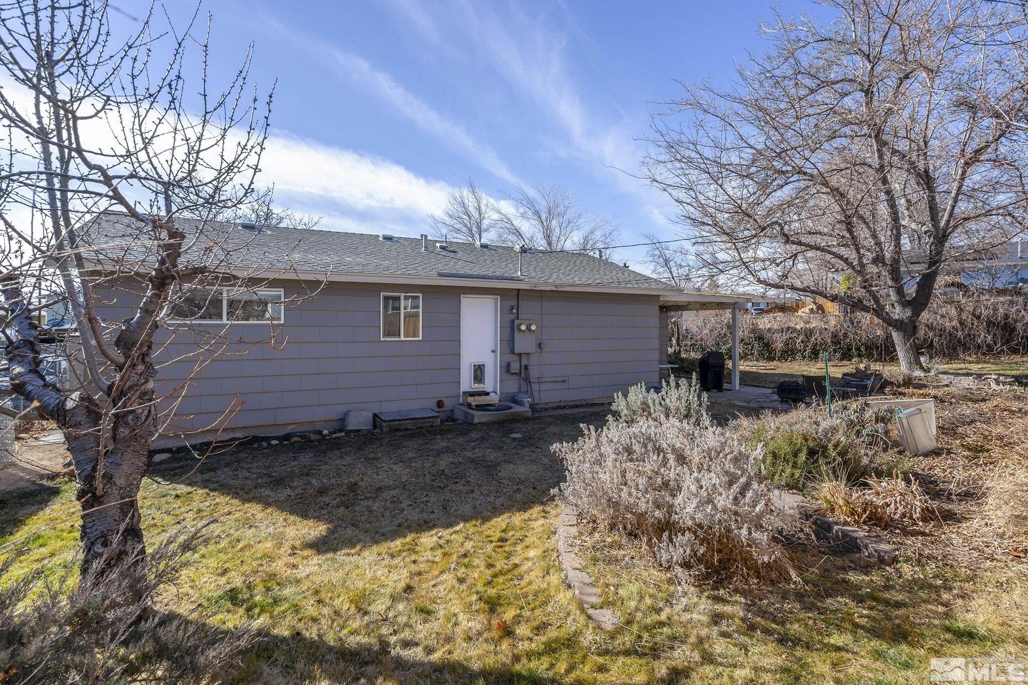 1370 Beldon Way Reno, NV 89503 - Photo 23 of 23 a view of a backyard with a large tree