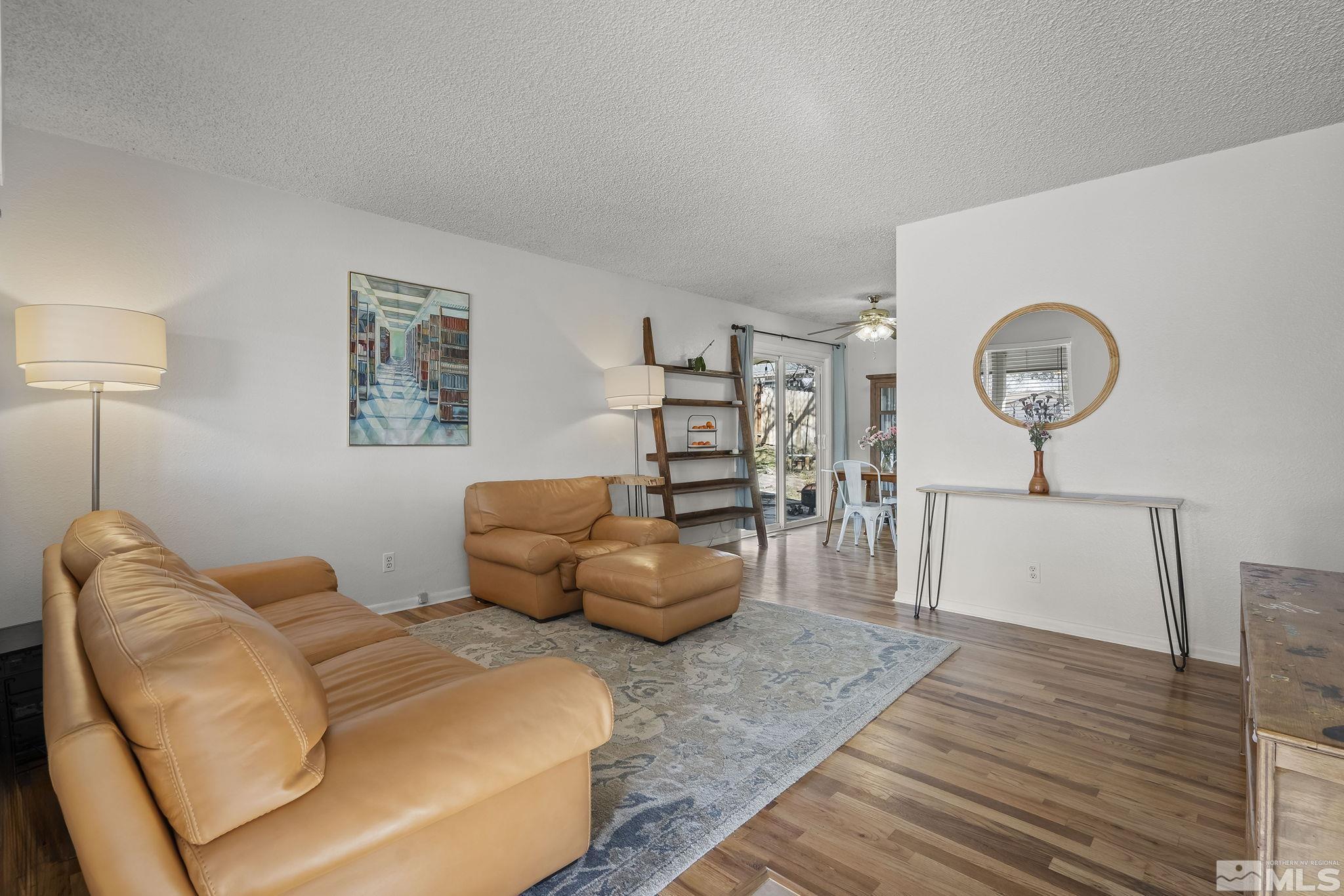1370 Beldon Way Reno, NV 89503 - Photo 3 of 23 a bedroom with a bed and a chandelier