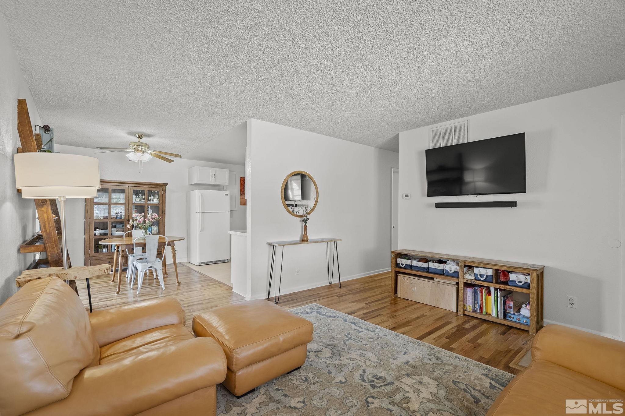 1370 Beldon Way Reno, NV 89503 - Photo 6 of 23 a living room with furniture and a flat screen tv