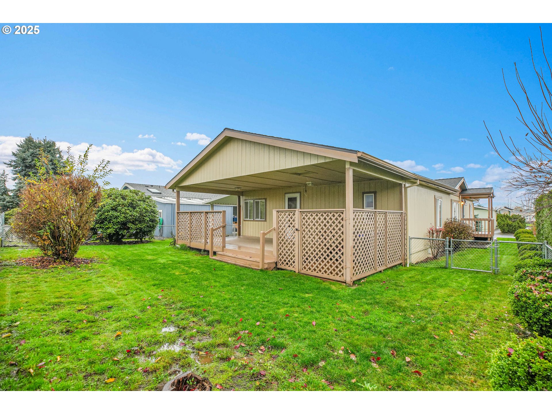 51459 Westlake Drive, Unit 102 Scappoose, OR 97056 - Photo 11 of 40 a view of a house with backyard and garden