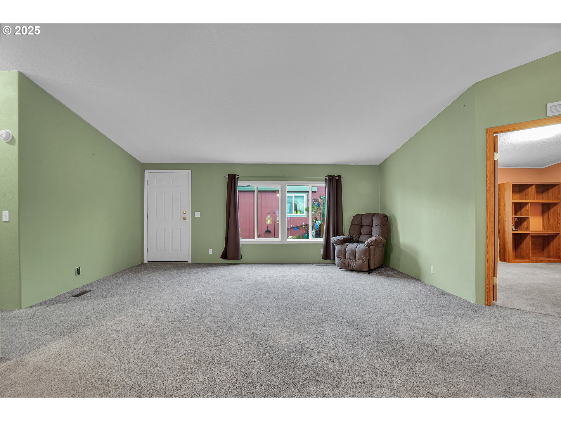 51459 Westlake Drive, Unit 102 Scappoose, OR 97056 - Photo 16 of 40 a view of a livingroom with workspace and a window