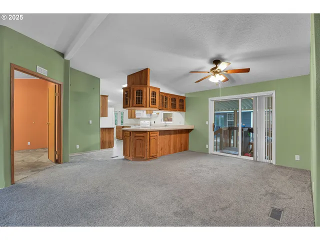 a view of an empty room with a bathroom