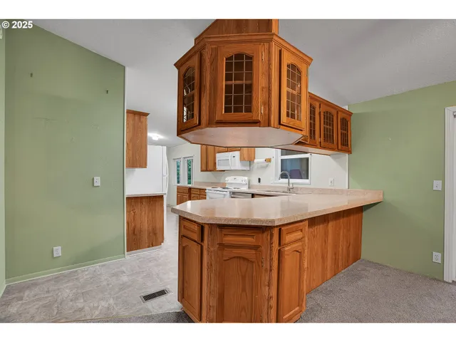 a bathroom with a sink a mirror and shower
