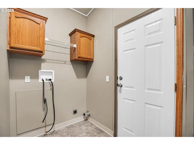 a view of a bathroom with mirror and shower
