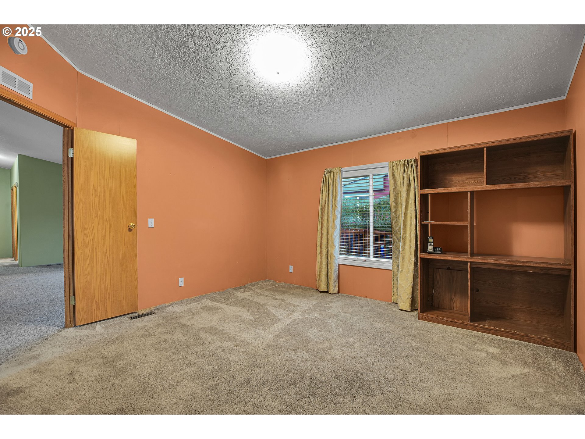 51459 Westlake Drive, Unit 102 Scappoose, OR 97056 - Photo 32 of 40 a view of an empty room with a fireplace
