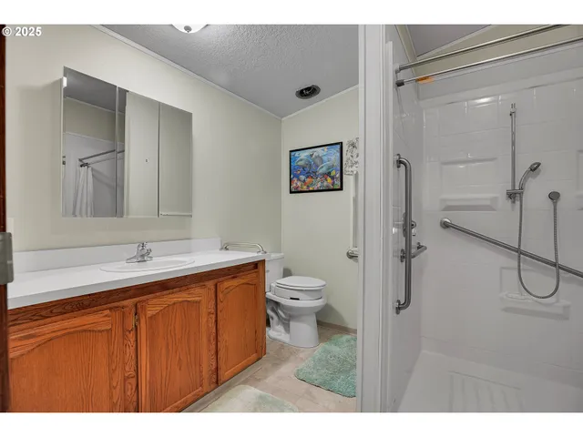 a bathroom with a shower and a sink