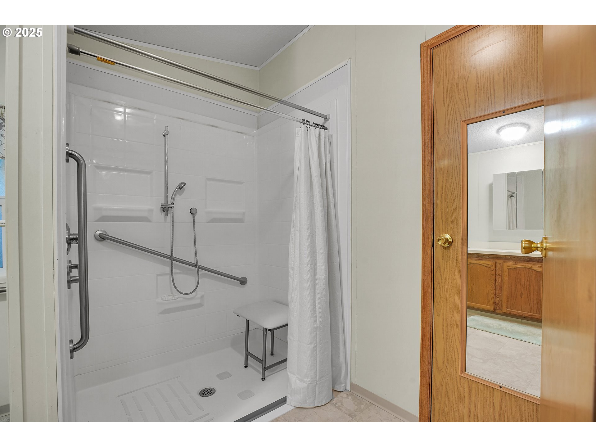 51459 Westlake Drive, Unit 102 Scappoose, OR 97056 - Photo 34 of 40 a bathroom with a shower and a sink