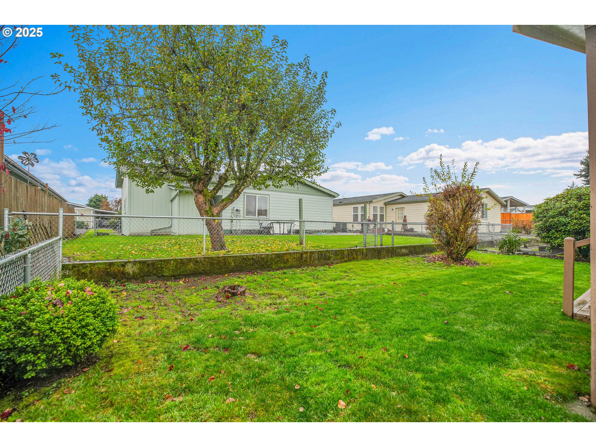 51459 Westlake Drive, Unit 102 Scappoose, OR 97056 - Photo 6 of 40 a view of a park with large trees