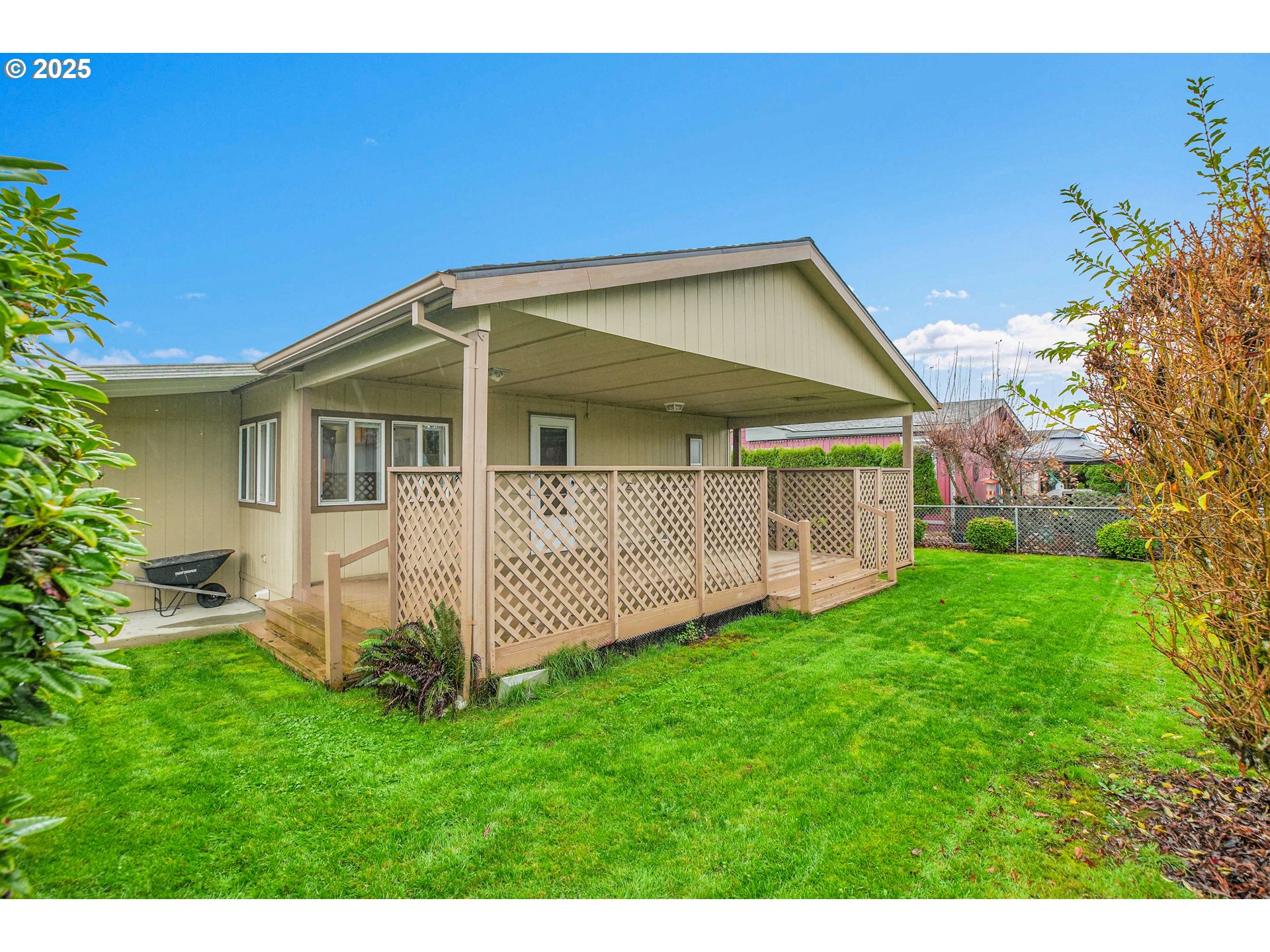 51459 Westlake Drive, Unit 102 Scappoose, OR 97056 - Photo 10 of 40 a view of a house with a yard