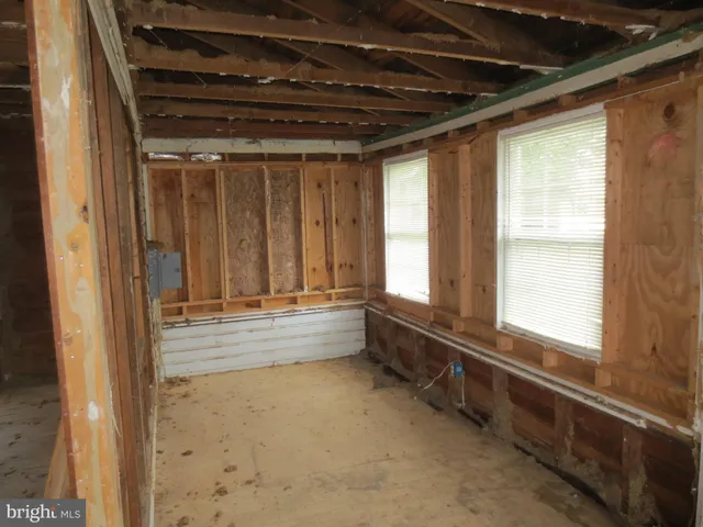 a view of room with window and furniture