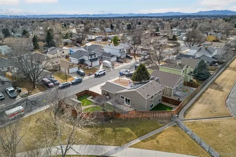 an aerial view of a house with a yard