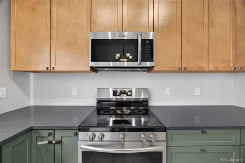 a kitchen with a stove and a microwave