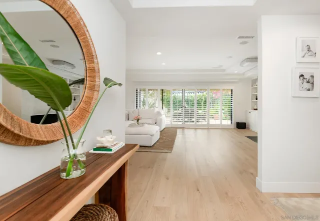 a view of an entryway and wooden floor