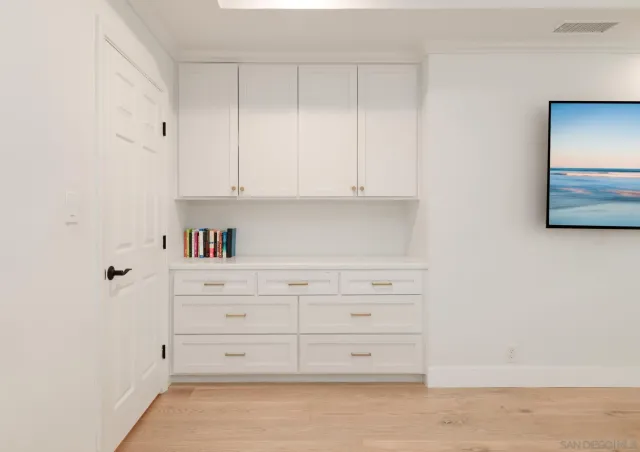 a bathroom with a granite countertop sink a shower and a mirror