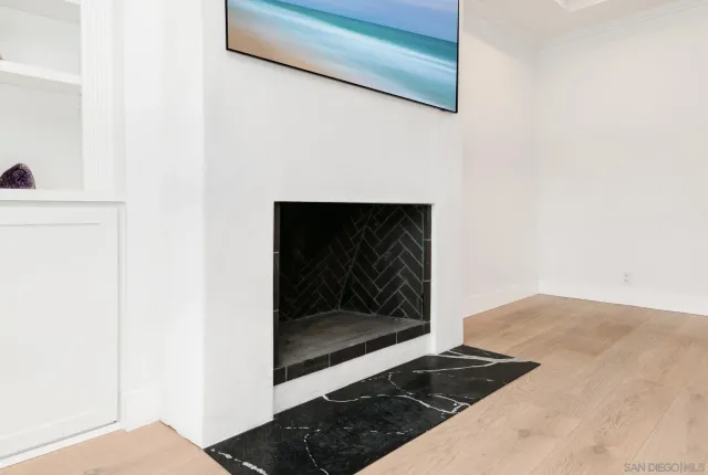 a view of a patio with table and chairs under an umbrella