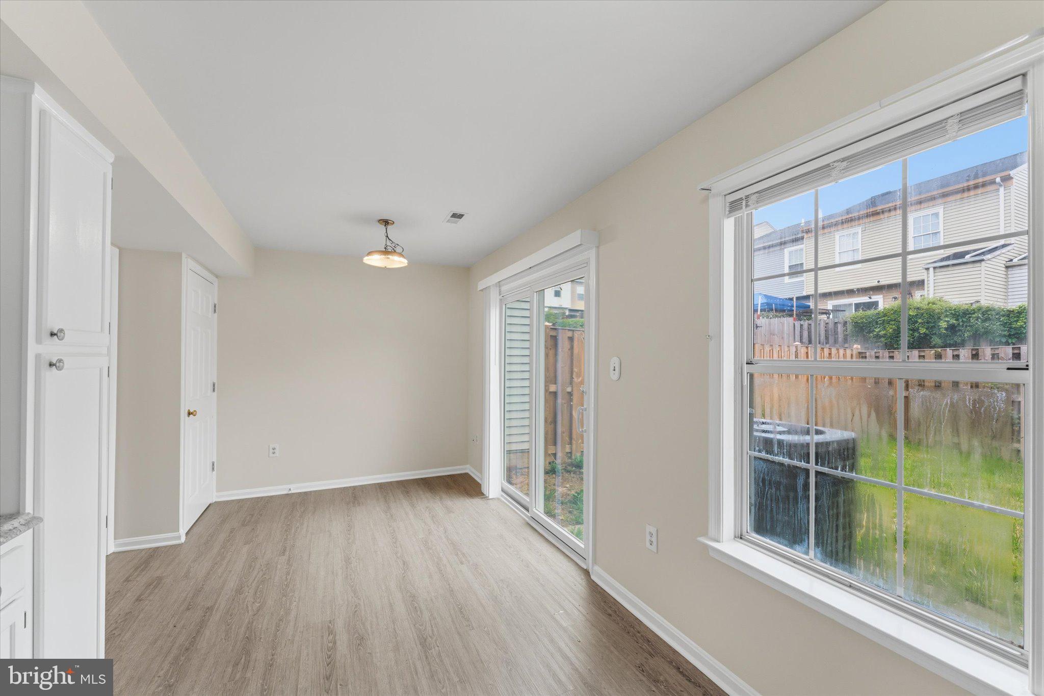 2753 Bixby Road Woodbridge, VA 22193 - Photo 5 of 22 wooden floor in an empty room with a window