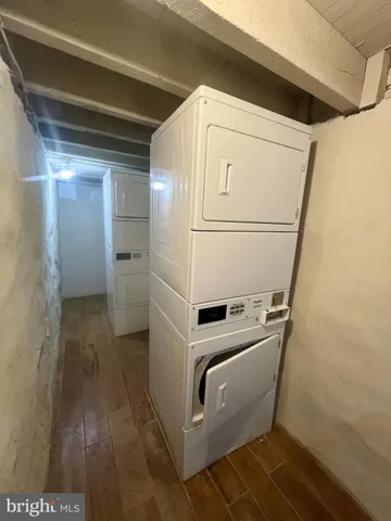 a living room with furniture and a stairs
