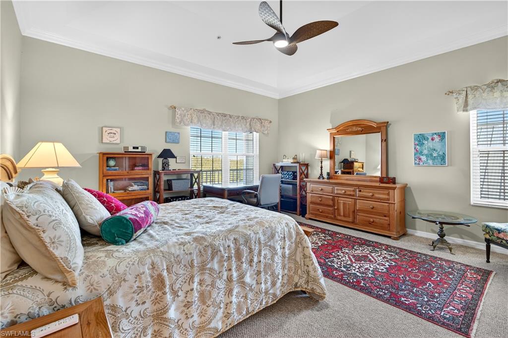 322 Angler Drive, Unit 502 Goodland, FL 34140 - Photo 18 of 38 Bedroom with carpet, crown molding, and ceiling fan