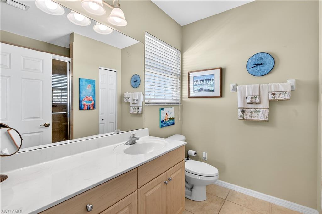 322 Angler Drive, Unit 502 Goodland, FL 34140 - Photo 19 of 38 Bathroom with vanity, light tile patterned floors