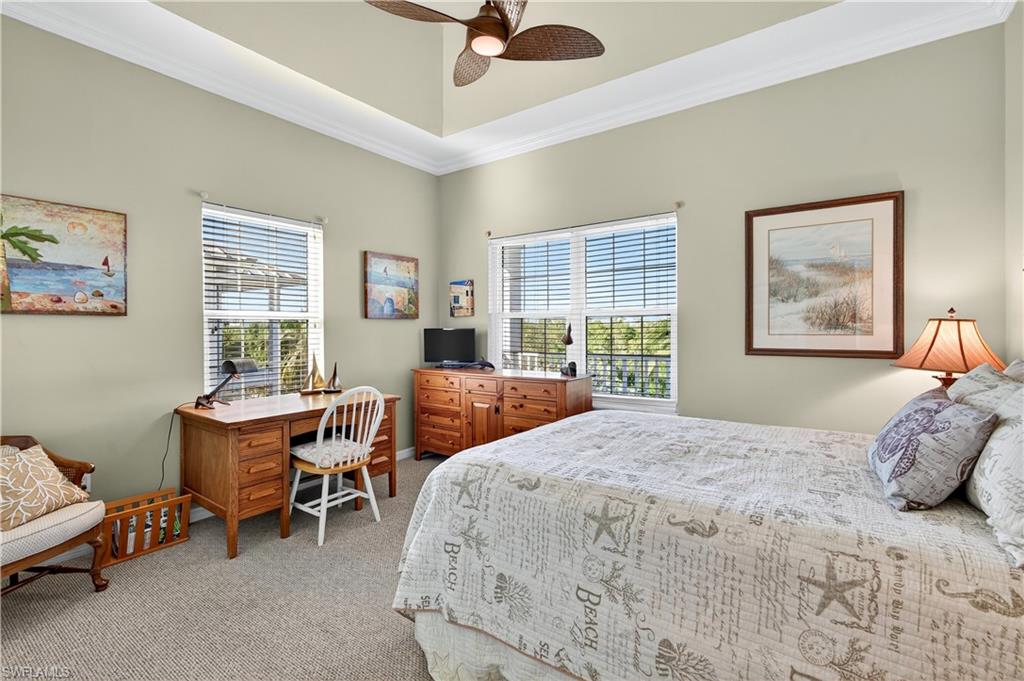 322 Angler Drive, Unit 502 Goodland, FL 34140 - Photo 22 of 38 Bedroom with crown molding, light carpet, and ceiling fan