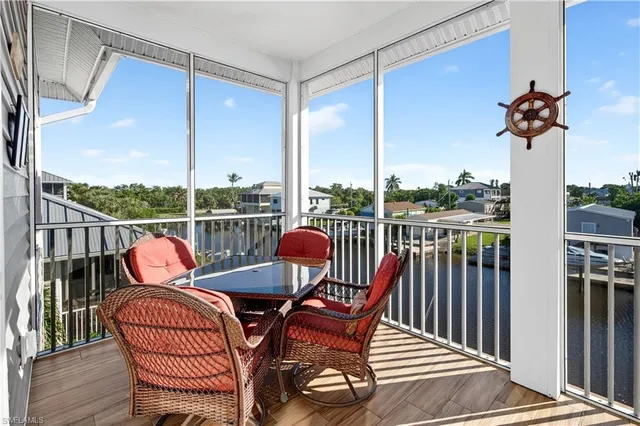a view of a balcony with furniture
