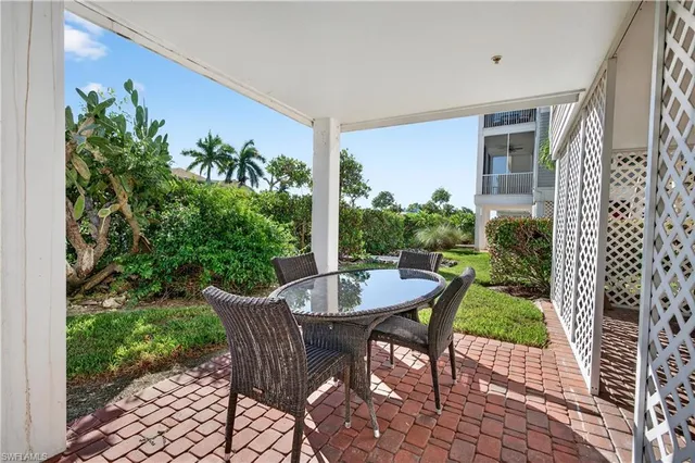 a view of a balcony with furniture