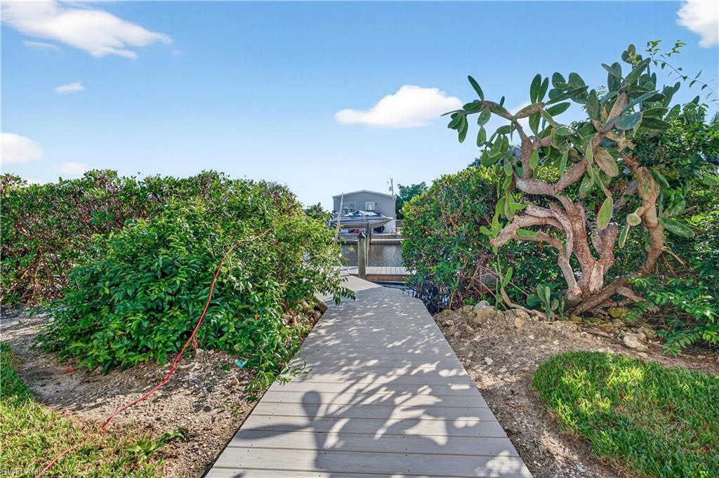 322 Angler Drive, Unit 502 Goodland, FL 34140 - Photo 30 of 38 Walk way to dock