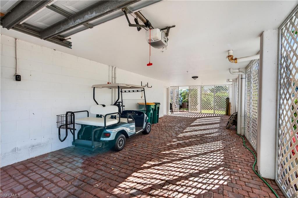 322 Angler Drive, Unit 502 Goodland, FL 34140 - Photo 34 of 38 Garage with a garage door opener