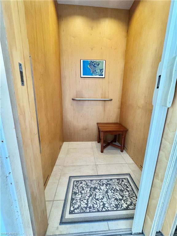 322 Angler Drive, Unit 502 Goodland, FL 34140 - Photo 35 of 38 Elevator with wooden walls