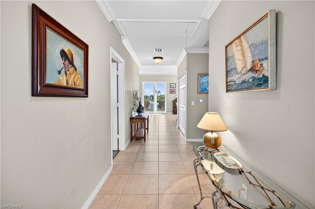 322 Angler Drive, Unit 502 Goodland, FL 34140 - Photo 8 of 38 Foer featuring attic access, light tile patterned flooring, and ornamental molding