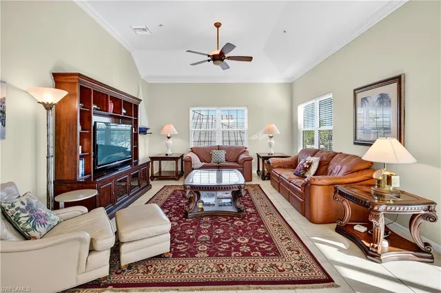 a living room with furniture rug and window