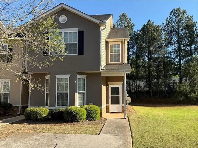 a front view of a house having yard