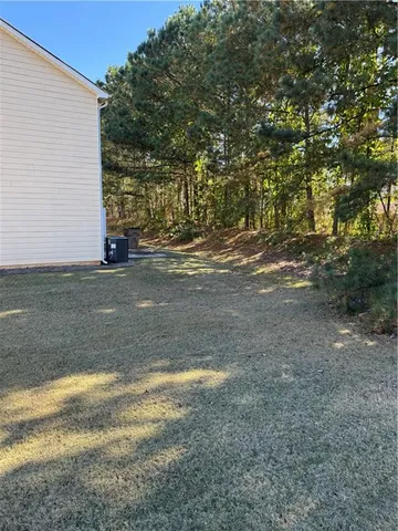 a view of a yard with an outdoor space