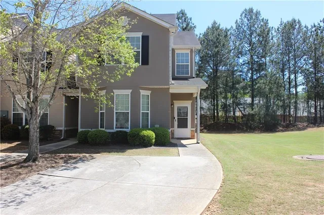 a view of a house with a garden