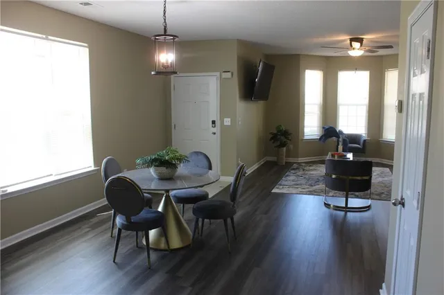 a view of a dining room with furniture window and wooden floor