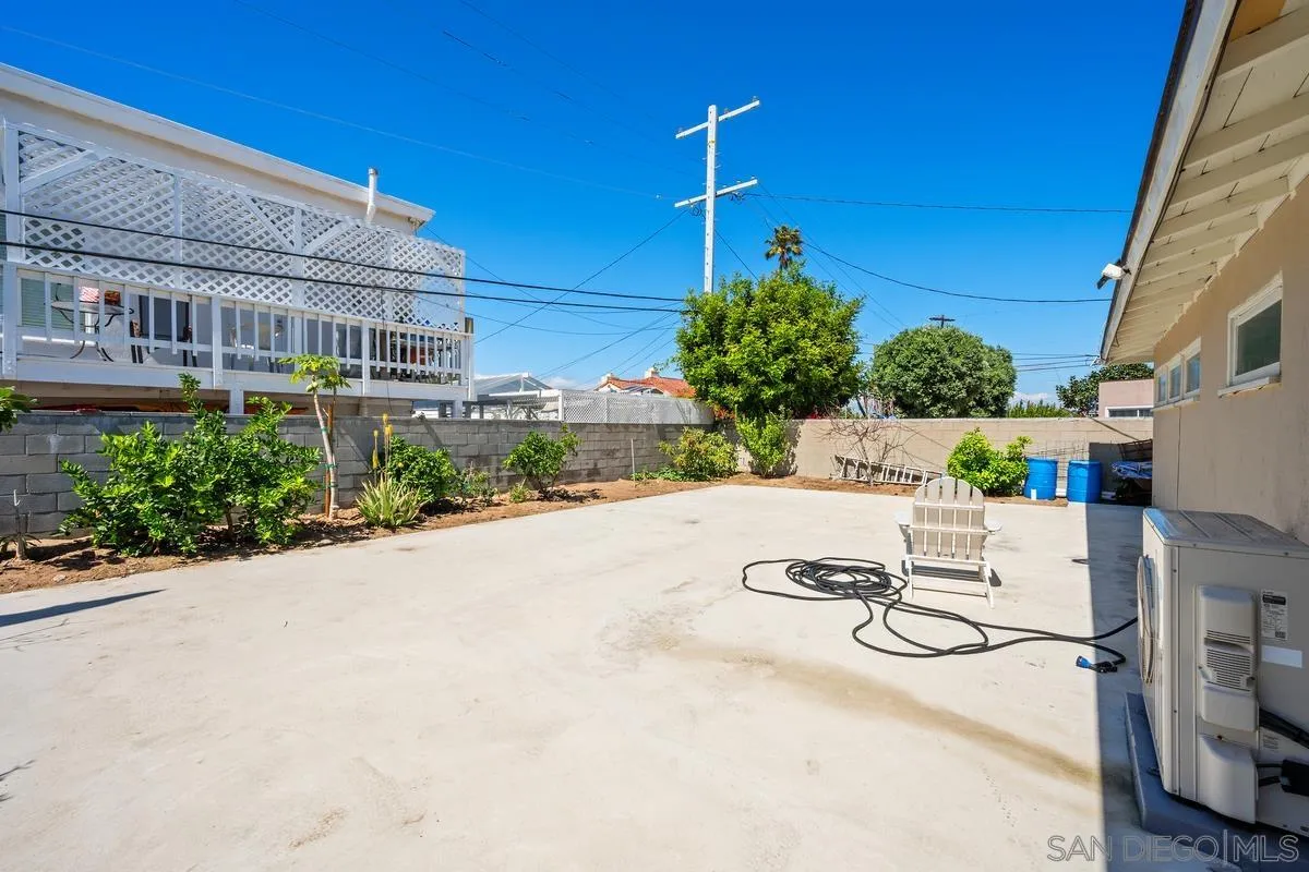 231 Sunridge Street Playa del Rey, CA 90293 - Photo 12 of 28 a view of a patio with a table and chairs and potted plants