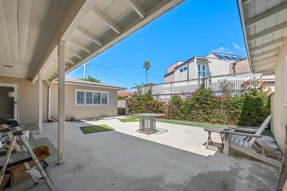 231 Sunridge Street Playa del Rey, CA 90293 - Photo 17 of 28 a view of a patio with a table and chairs and potted plants