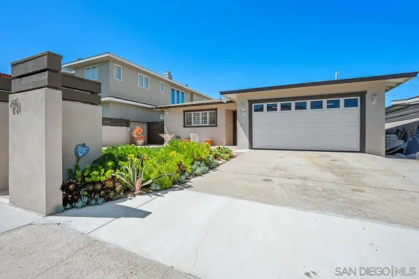 a front view of a house with a garage