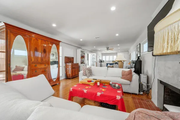 a living room with furniture and a fireplace