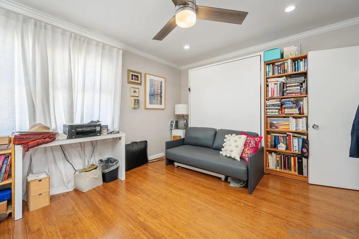231 Sunridge Street Playa del Rey, CA 90293 - Photo 27 of 28 a living room with furniture and a book shelf
