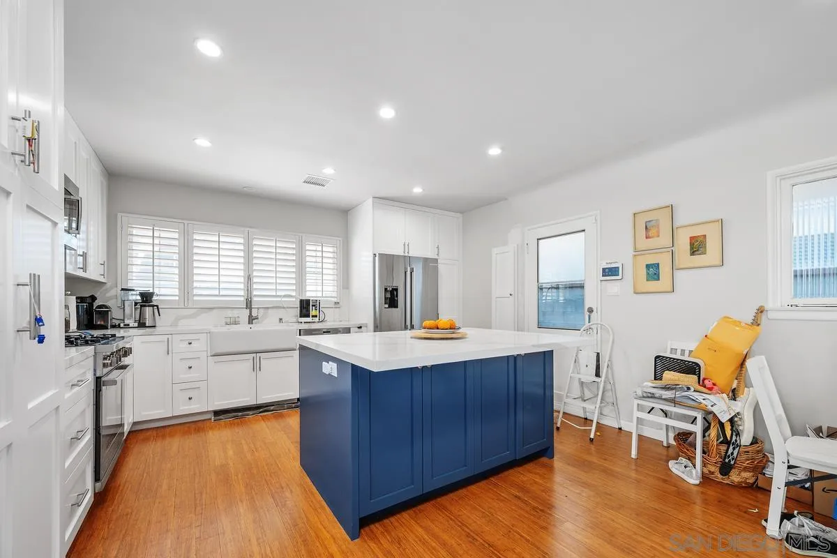 231 Sunridge Street Playa del Rey, CA 90293 - Photo 3 of 28 a kitchen with a sink cabinets and wooden floor