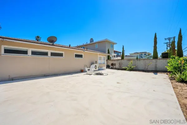 a view of a backyard of a house