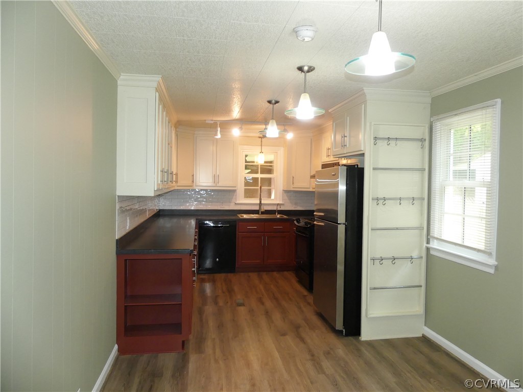 272 Germantown Road Keysville, VA 23947 - Photo 12 of 34 a kitchen with granite countertop a refrigerator cabinets and wooden floor