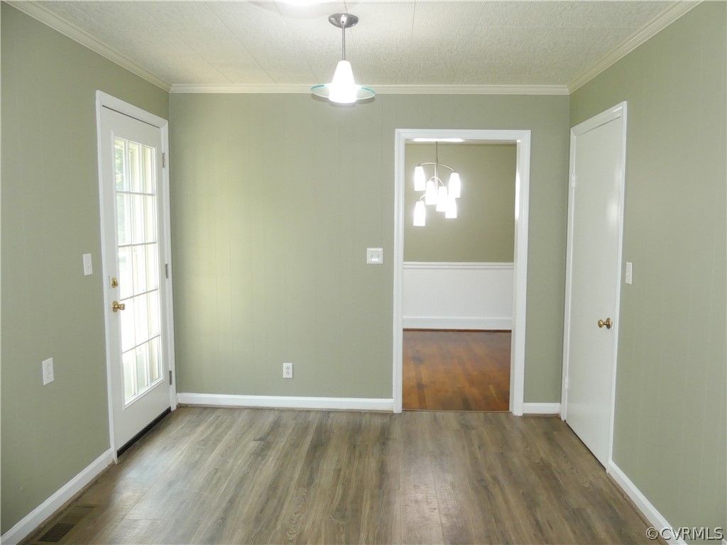 272 Germantown Road Keysville, VA 23947 - Photo 16 of 34 an empty room with wooden floor and windows